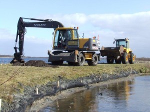 Aanleg strekdam kraan en shovel